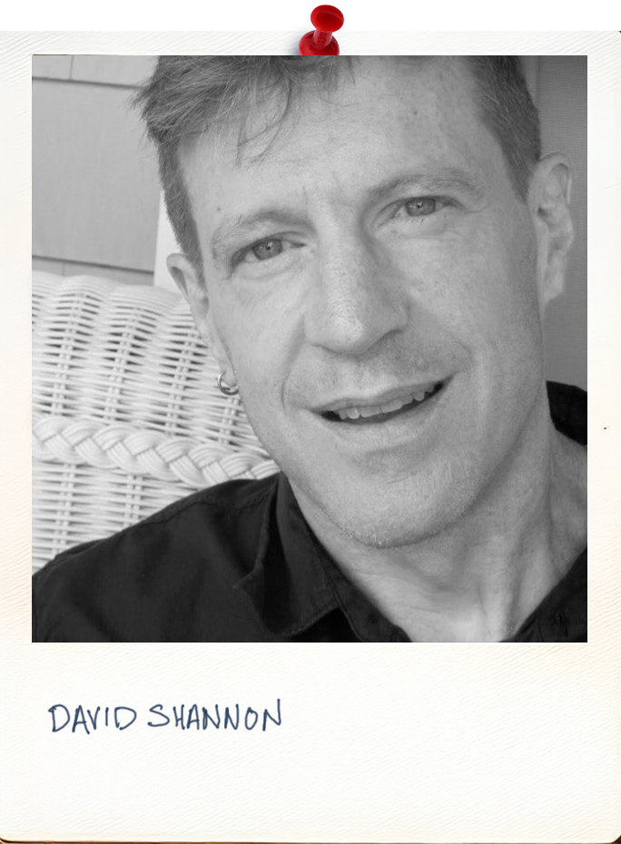 David_Shannon_photo A photo of David Shannon stylized in a polaroid photo border. A man l wearing a black t-shirt. David is looking directly at the camera. With a gentle smile. The image includes his head and shoulders.