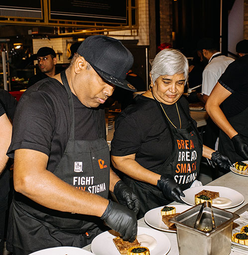 Junes_Chefs Food being prepared to go to the tables behind the scenes, at June's HIV Eatery
